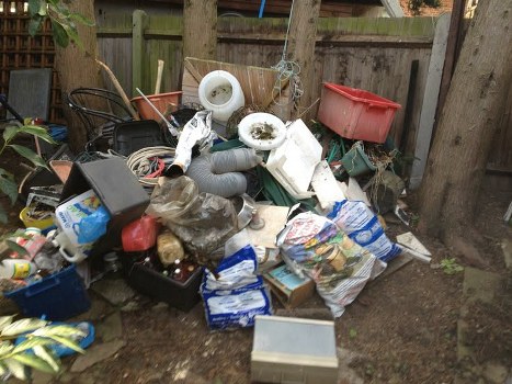 Construction workers managing waste on a Chelsea project site